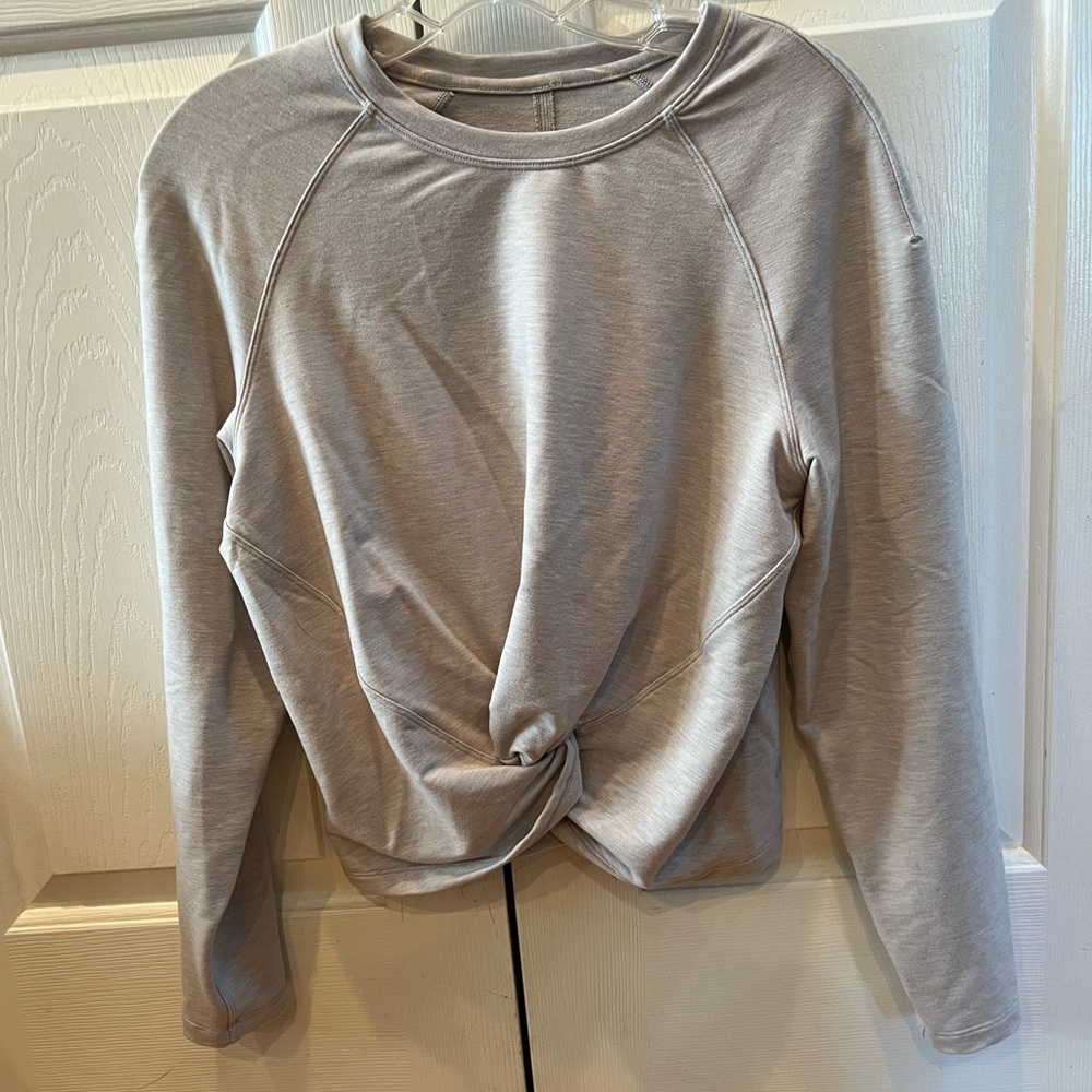 Lululemon sweatshirt with cute twist tie at the bottom